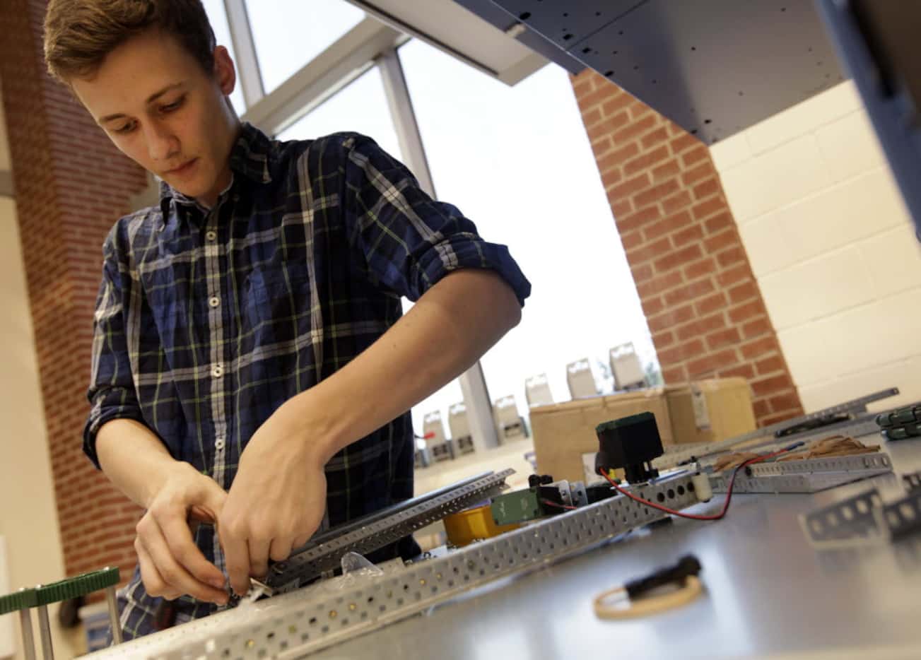 Connor Redding, 17, works on a project in a robotics class at Lovejoy High School in Lucas....