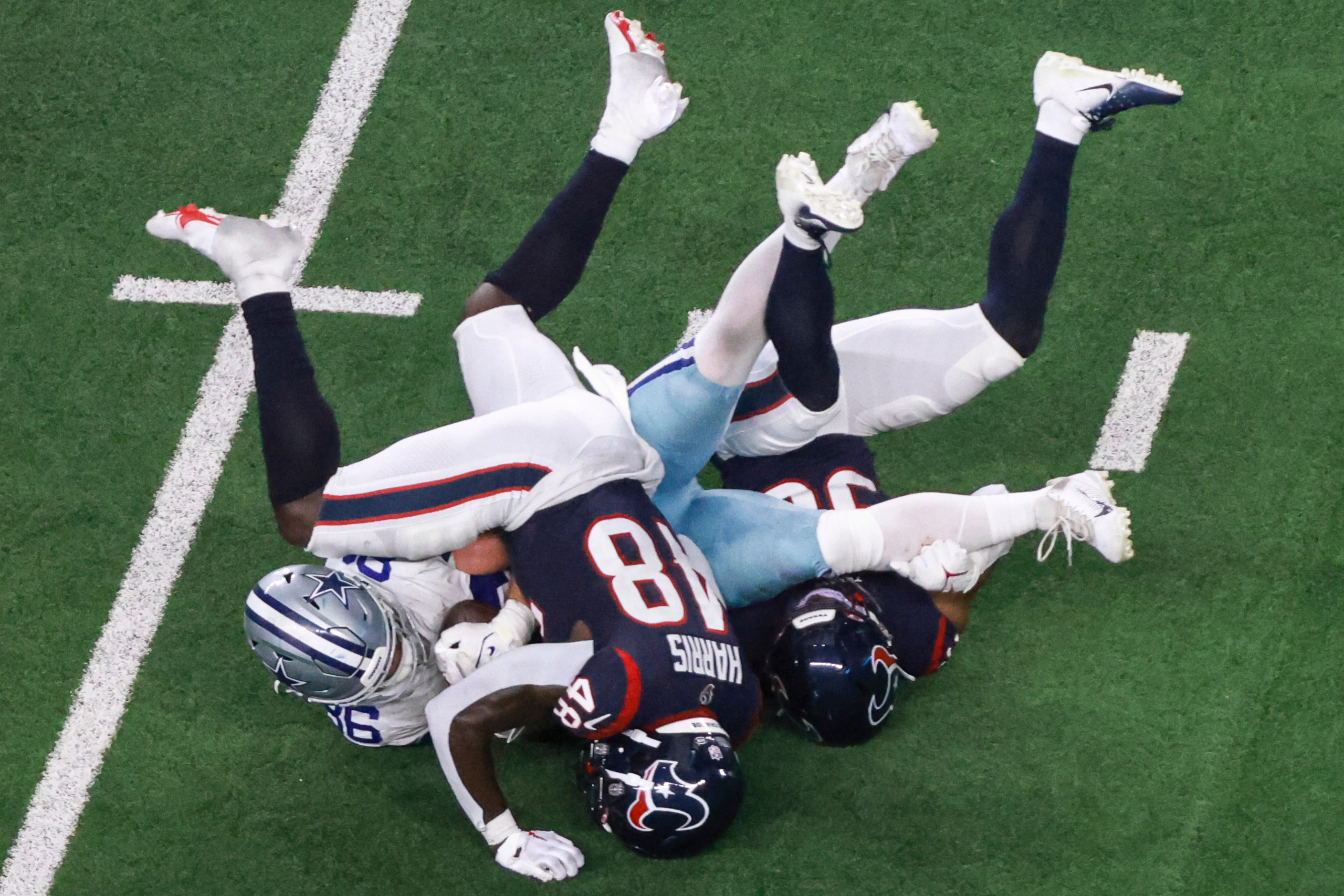 Houston Texans linebacker Christian Harris (48) and Houston Texans safety Jonathan Owens...