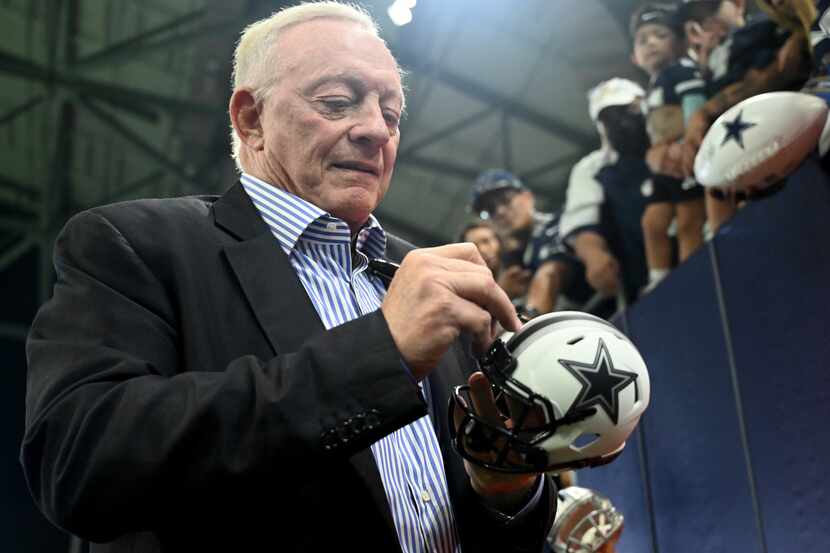 Jerry Jones signs autographs before Dallas Cowboys practice at Ford Center at The Star,...