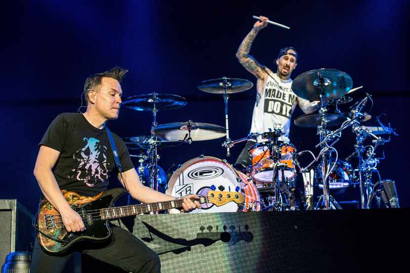 Mark Hoppus, left, and Travis Barker of blink-182 perform at the 2016 KROQ Almost Acoustic...