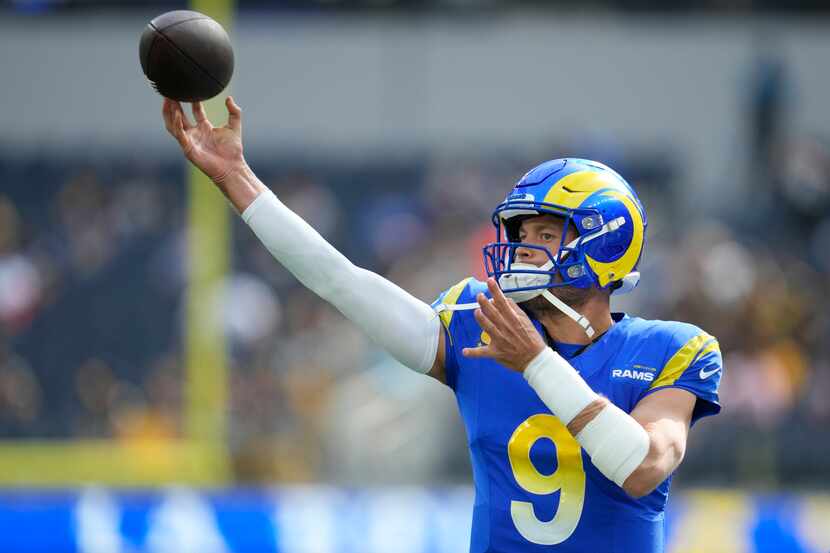 Los Angeles Rams quarterback Matthew Stafford warms up before an NFL football game against...