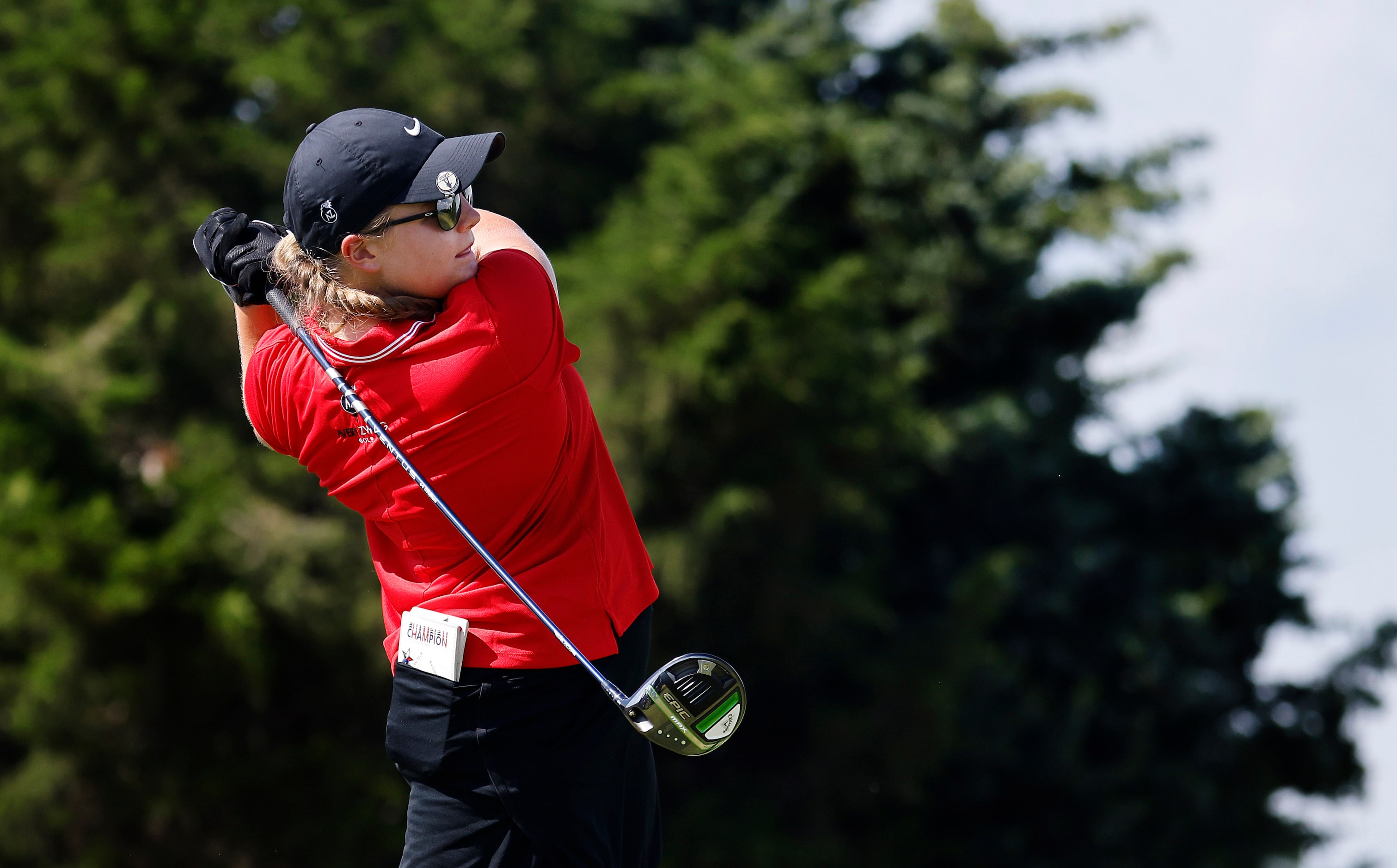 Amateur golfer Avery Zweig, 14, of McKinney fowls through on her drive off the 10th tee box...