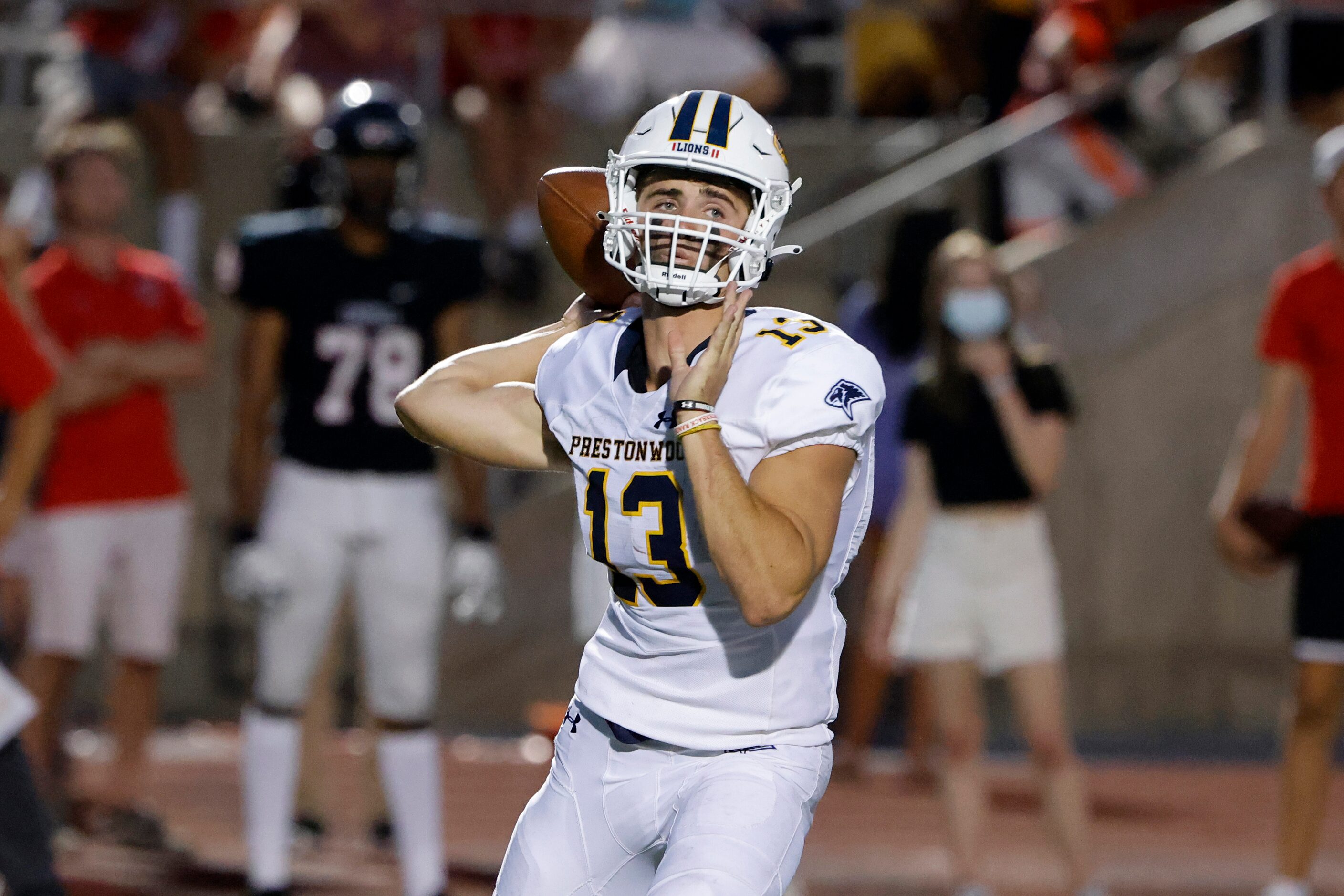 Prestonwood Christian Academy quarterback Maguire Martin (13) throws against Coppell during...