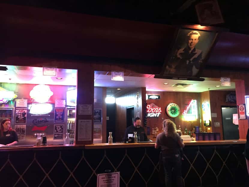 The historic Cain's Ballroom dance hall and concert venue has walls lined with portraits of...