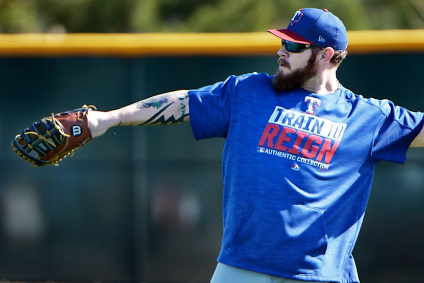 Texas Rangers first baseman Josh Hamilton plays catch during spring training in Surprise,...