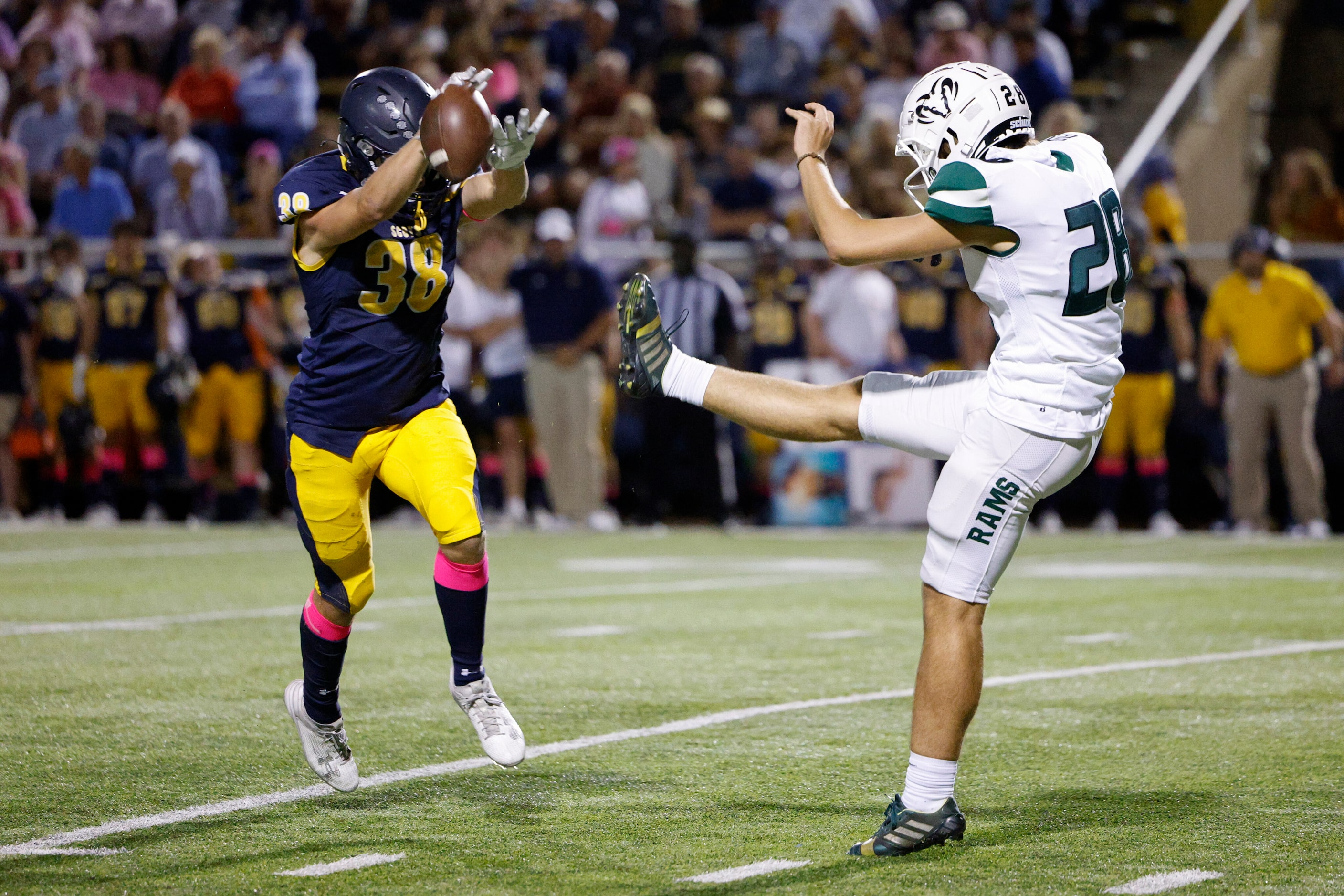 Highland Park’s Brant Williams (38) blocks the punt of Richardson Berkner’s Elkazzaz Basha...