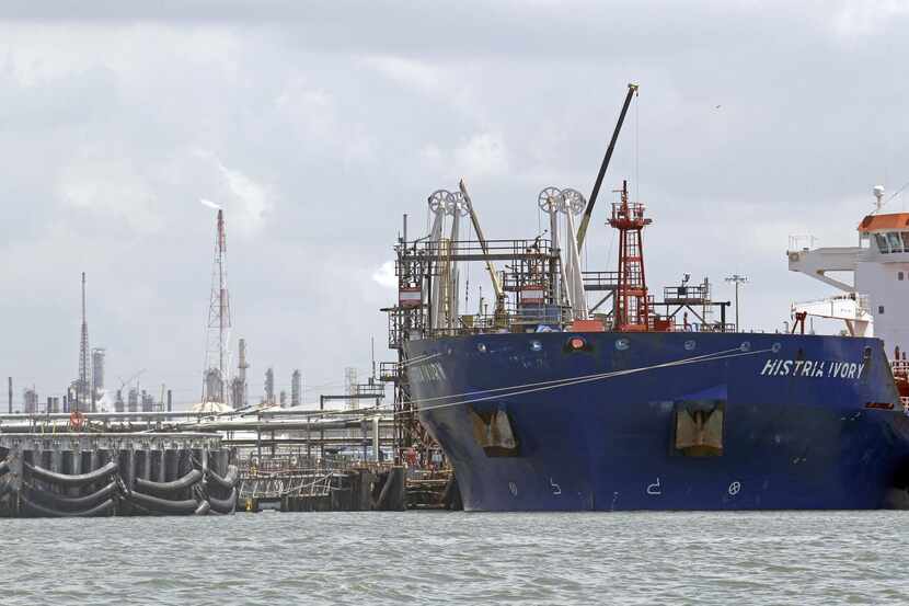 
An oil tanker is docked at the Exxon Mobil’s Baytown complex along the Houston Ship...