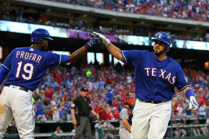 ARLINGTON, TX - JUNE 07: Jurickson Profar #19 of the Texas Rangers congratulates Bobby...
