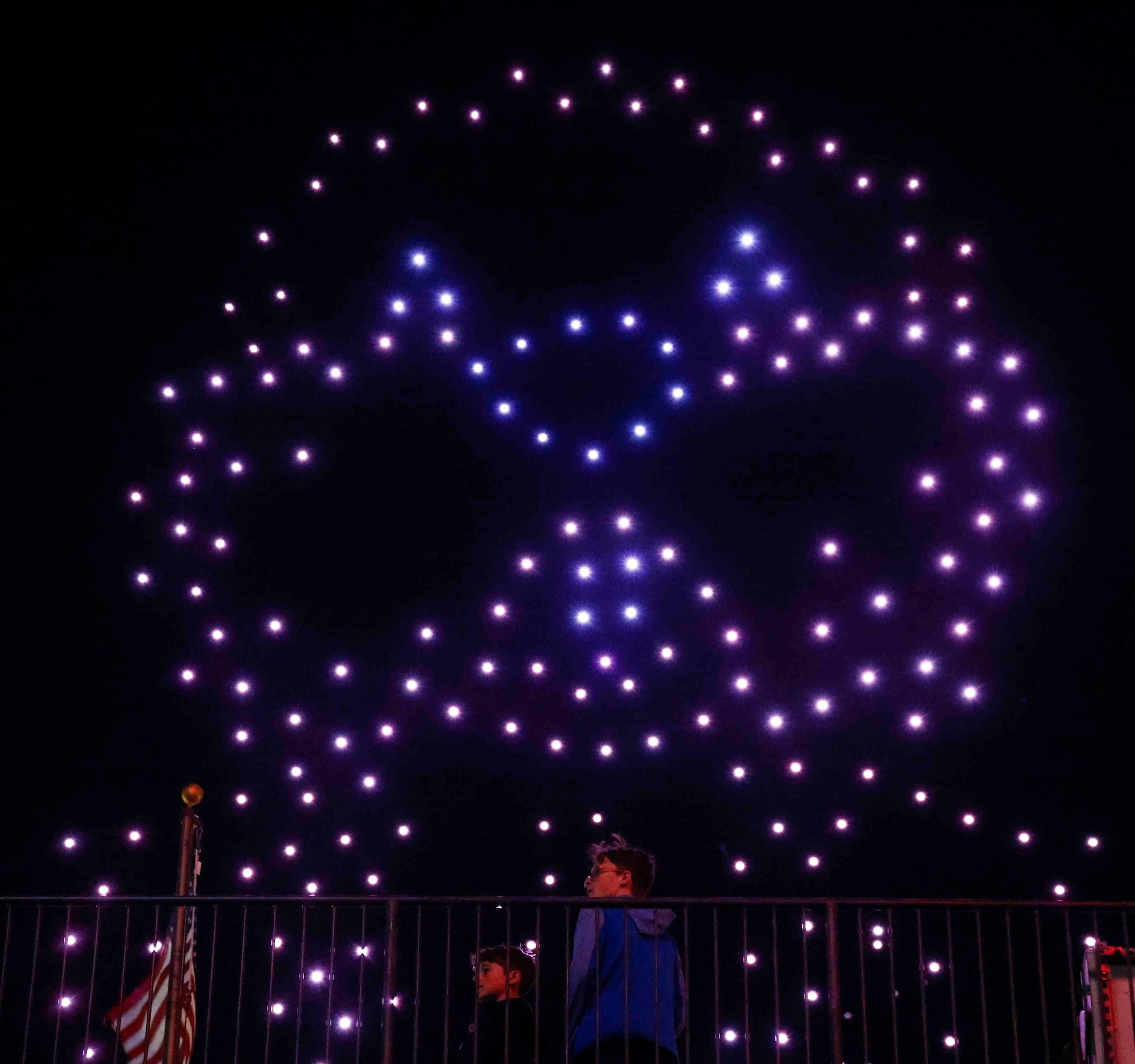 Crowd watches a live drone light show after an MLS soccer match on Saturday, March 4, 2023,...