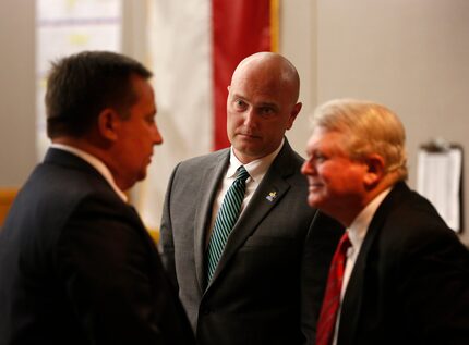 Roy Oliver (middle), who is charged with murder in the fatal shooting of 15-year-old Jordan...