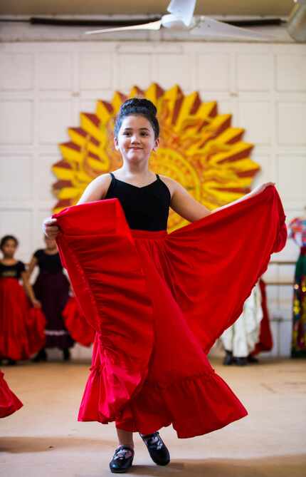 Eva Johnson, 7, dances during company auditions at the Anita N. Martinez Ballet Folklorico.