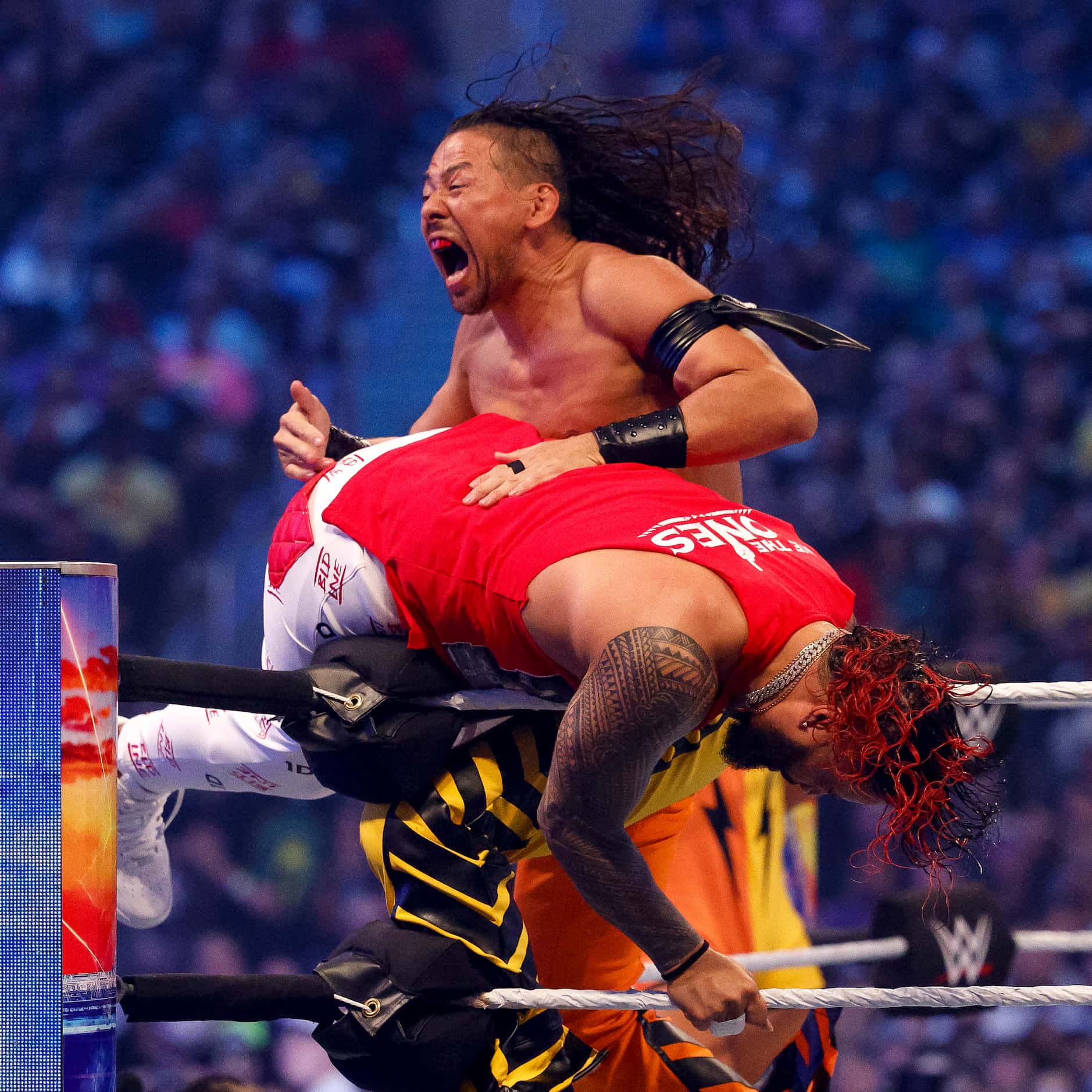 Shinsuke Nakamura (left) battles Jimmy Uso during the SmackDown Tag Team Championship at...