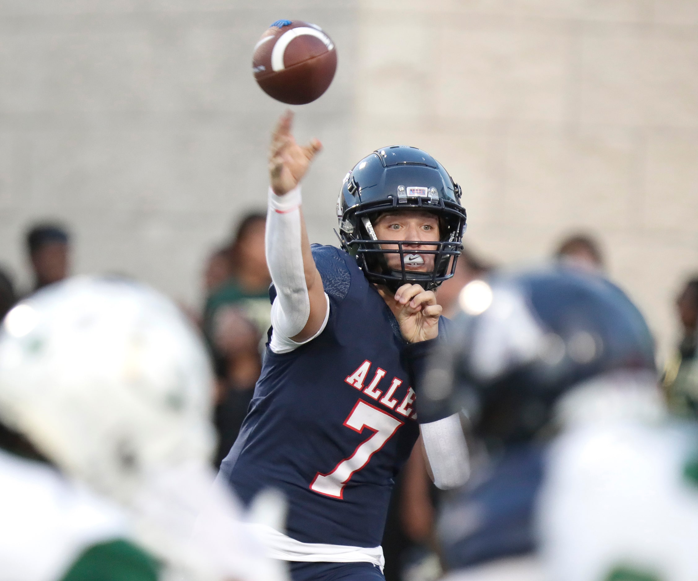 Allen High School quarterback Brady Bricker (7) throws a pass during the first half as Allen...