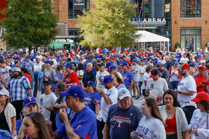 Fans wait outside of Globe Life Field ahead of game 1 of the World Series between Texas...