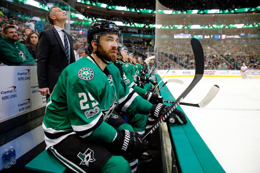 Dallas Stars defenseman Greg Pateryn (29) watches his new teammates from the bench during...