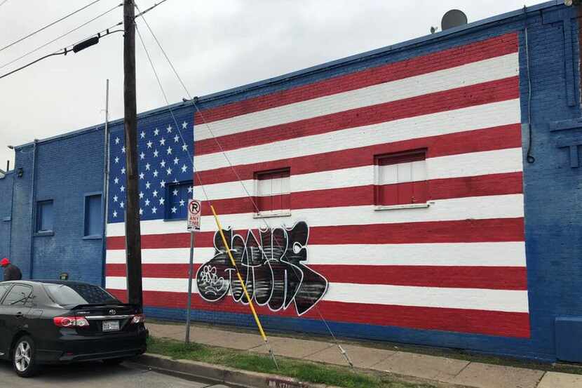 A photo posted by Dallas restaurant owner Pete Zotos shows the defaced mural.