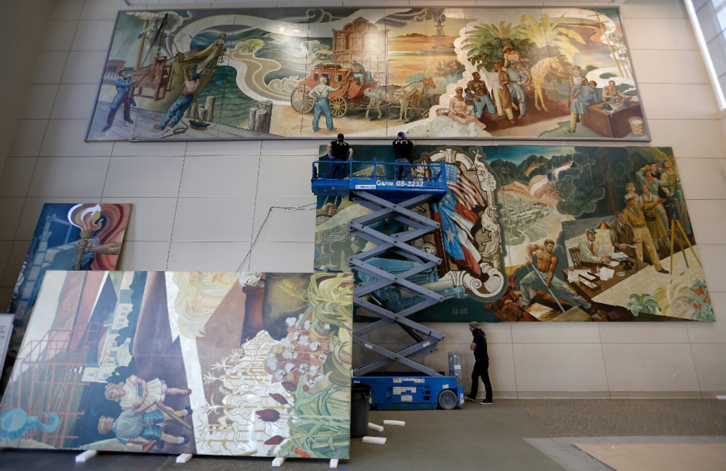 Workers from Unified Fine Arts removed the murals from the walls of the TXCN building in...
