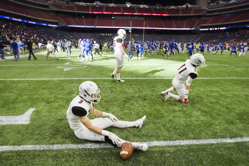 Argyle's Drew Estrada (3) and John Tarwater (11) sit on the field after the final play of a...
