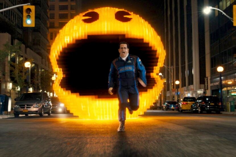 This photo provided by courtesy of Sony Pictures shows Josh Gad as Ludlow chased by Pac-Man...