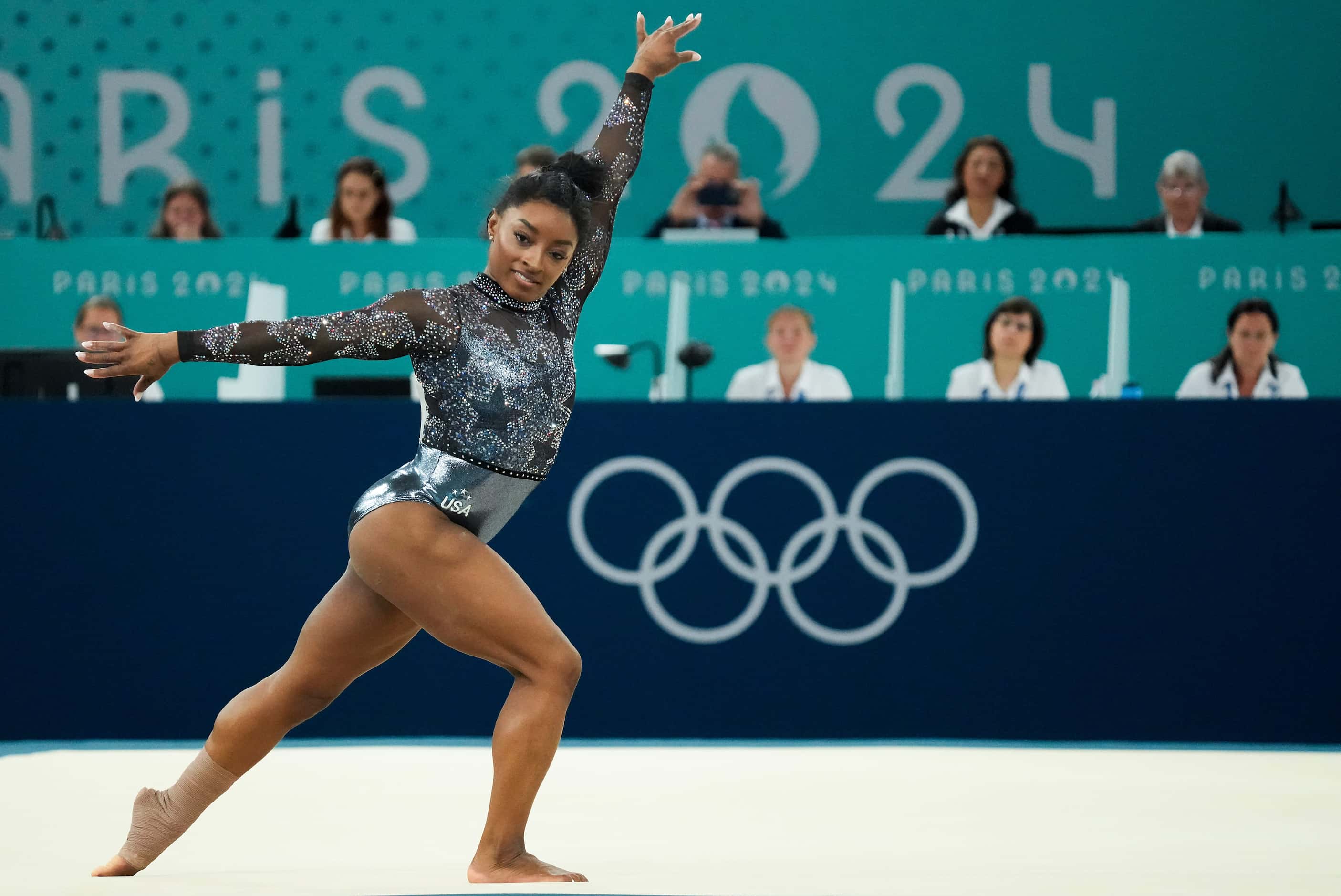 Simone Biles of the United States competes on the floor during women’s gymnastics qualifying...