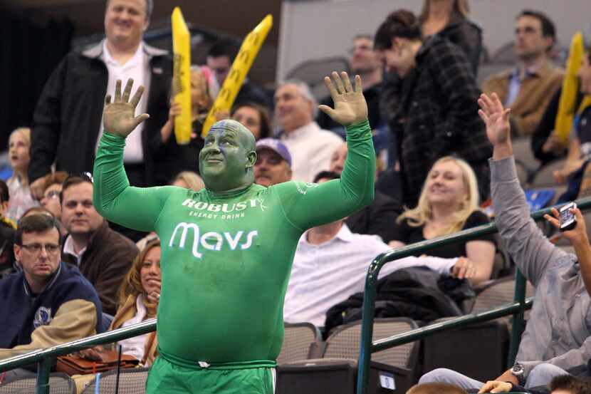 A Mavs fan cheers for the home team during the Sacramento Kings vs. the Dallas Mavericks NBA...