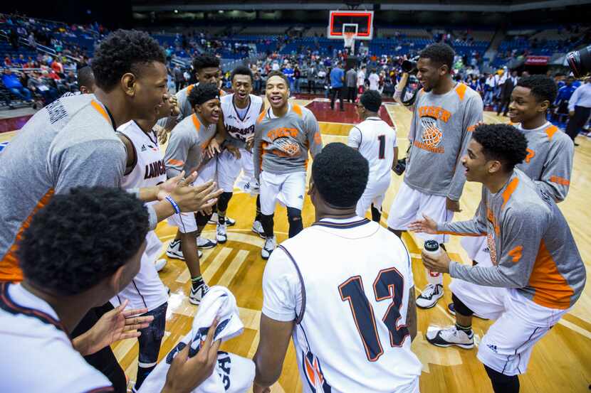 Lancaster celebrates a 59-47 win over Beaumont Ozen after their UIL Class 5A state...