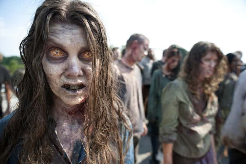 Zombies appear in a scene from the second season of the AMC original series, The Walking Dead.