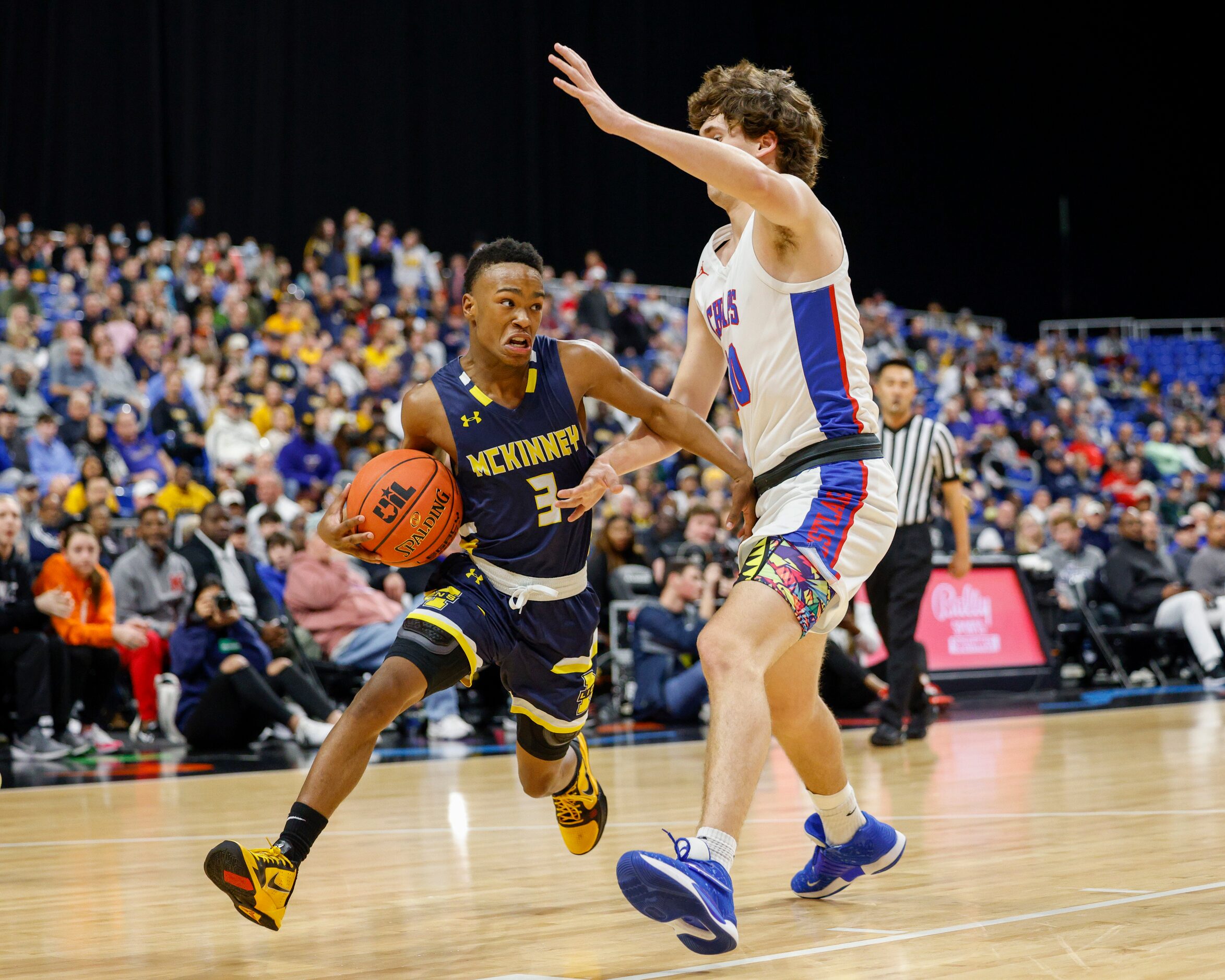 McKinney guard Jacovey Campbell (3) drives around Austin Westlake forward Michael Bustamante...