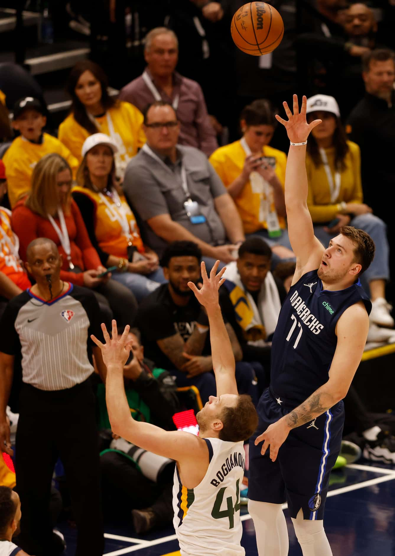 Dallas Mavericks guard Luka Doncic (77) shoots in front of Utah Jazz forward Bojan...