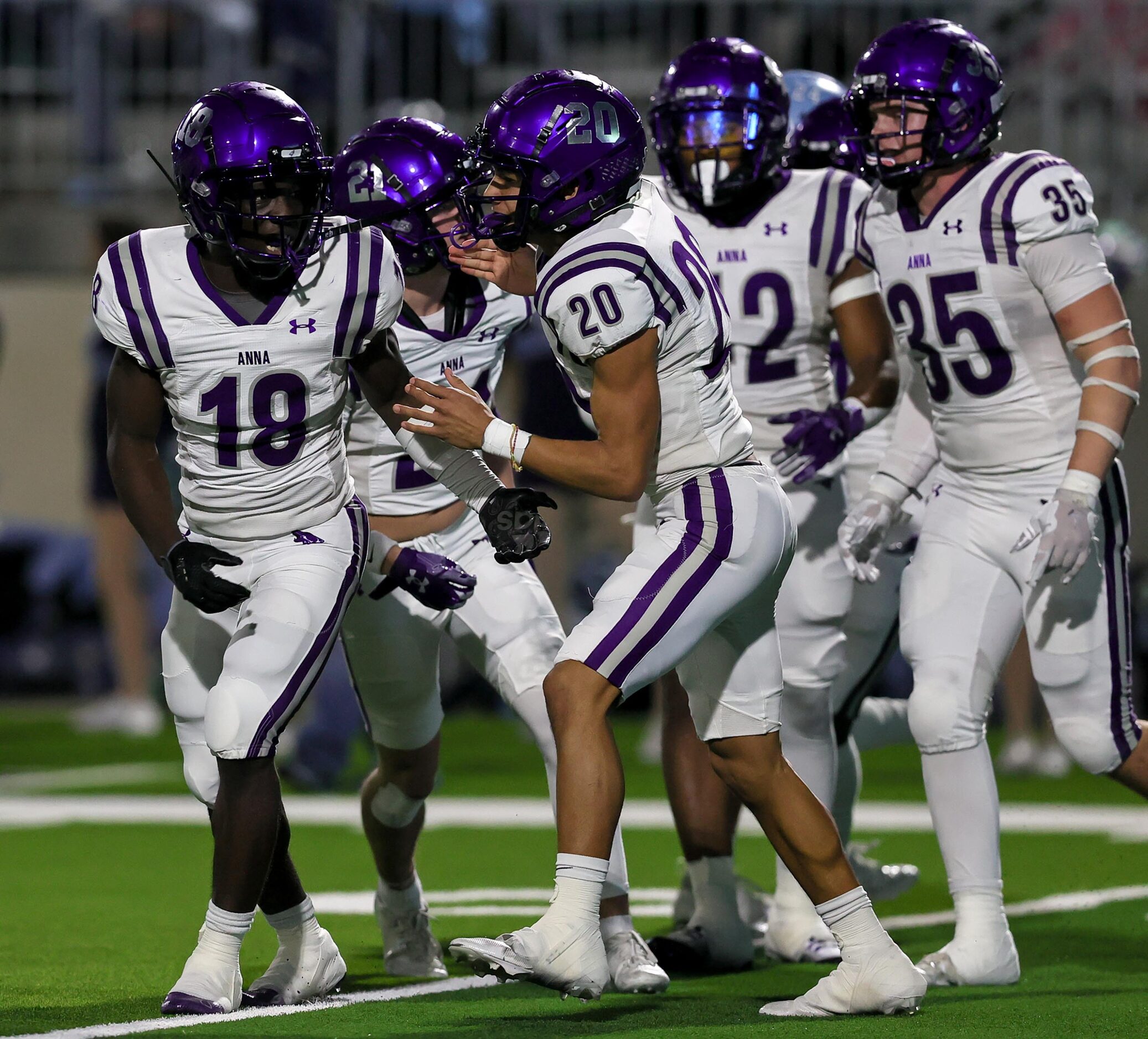 Anna defensive back Jacob Mott (18) celebrates with defensive back Nolan Galyean (20) after...