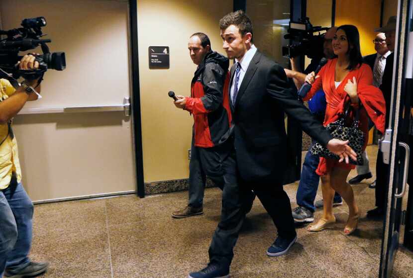 Johnny Manziel left the Frank Crowley Courts Building on Thursday, after prosecutors said in...