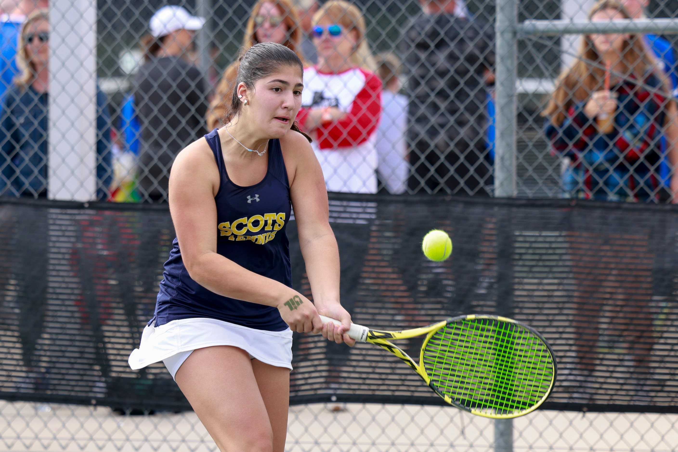 Highland Park’s Eden Rogozinski eyes her shot during the 5A girls doubles championship match...