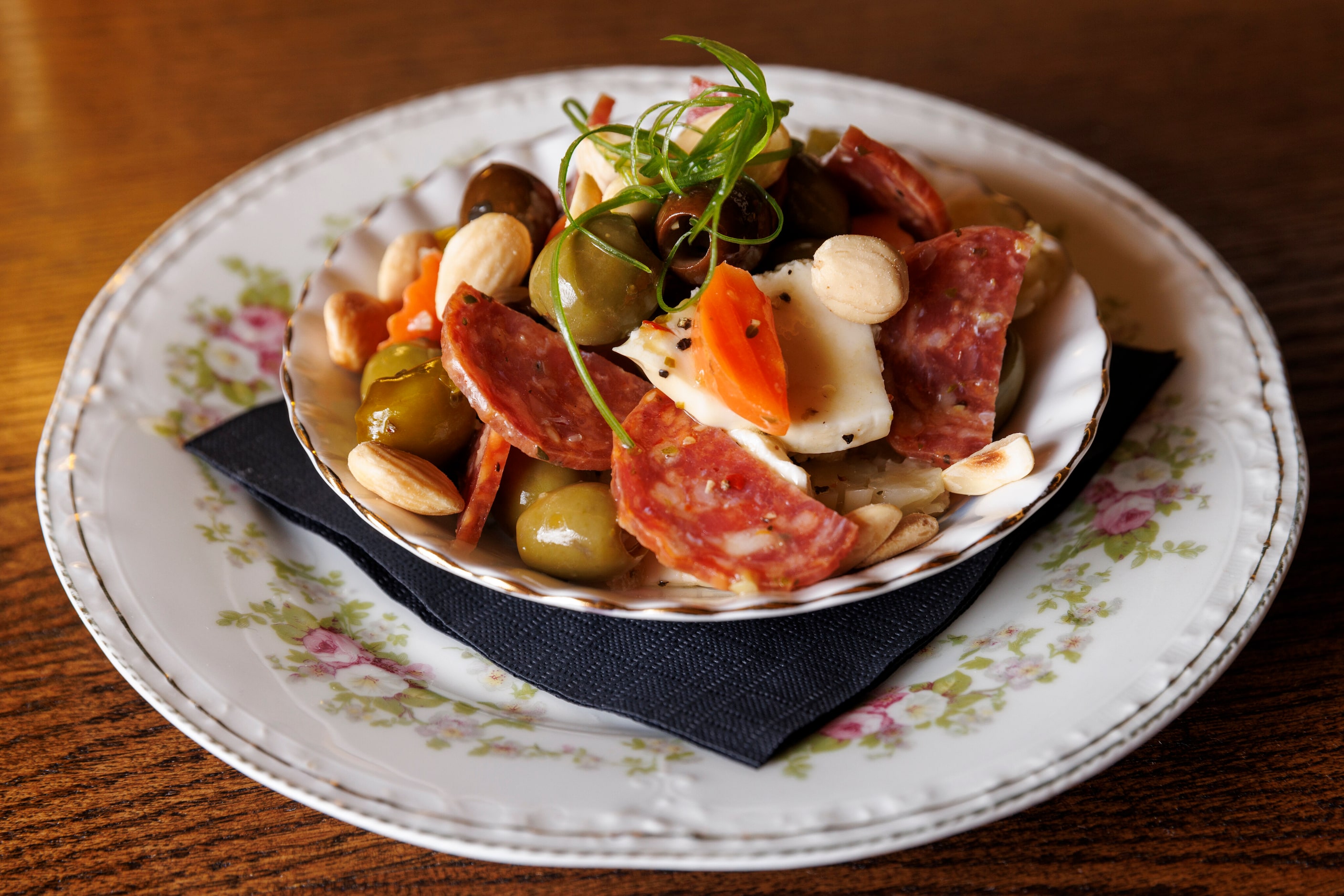 Olives and Marcona almonds are a bar snack at Boxcar in Dallas.