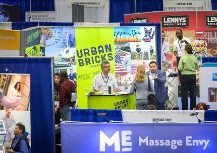 Sammy Aldeeb, founder & CEO of Urban Bricks Pizza Co., gestures at talks to a visitor to the...