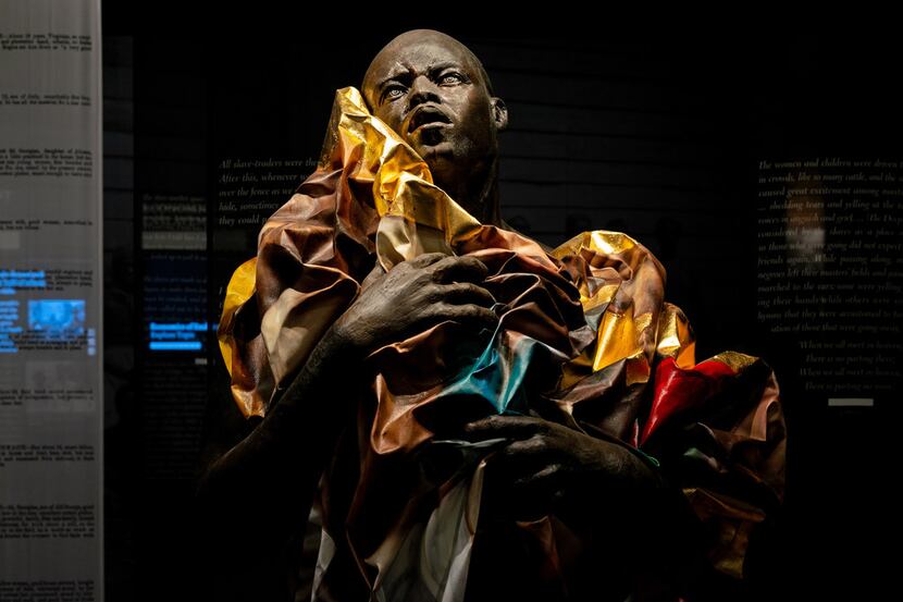 A sculpture by artist Titus Kaphur at the Legacy Museum: From Enslavement to Mass...