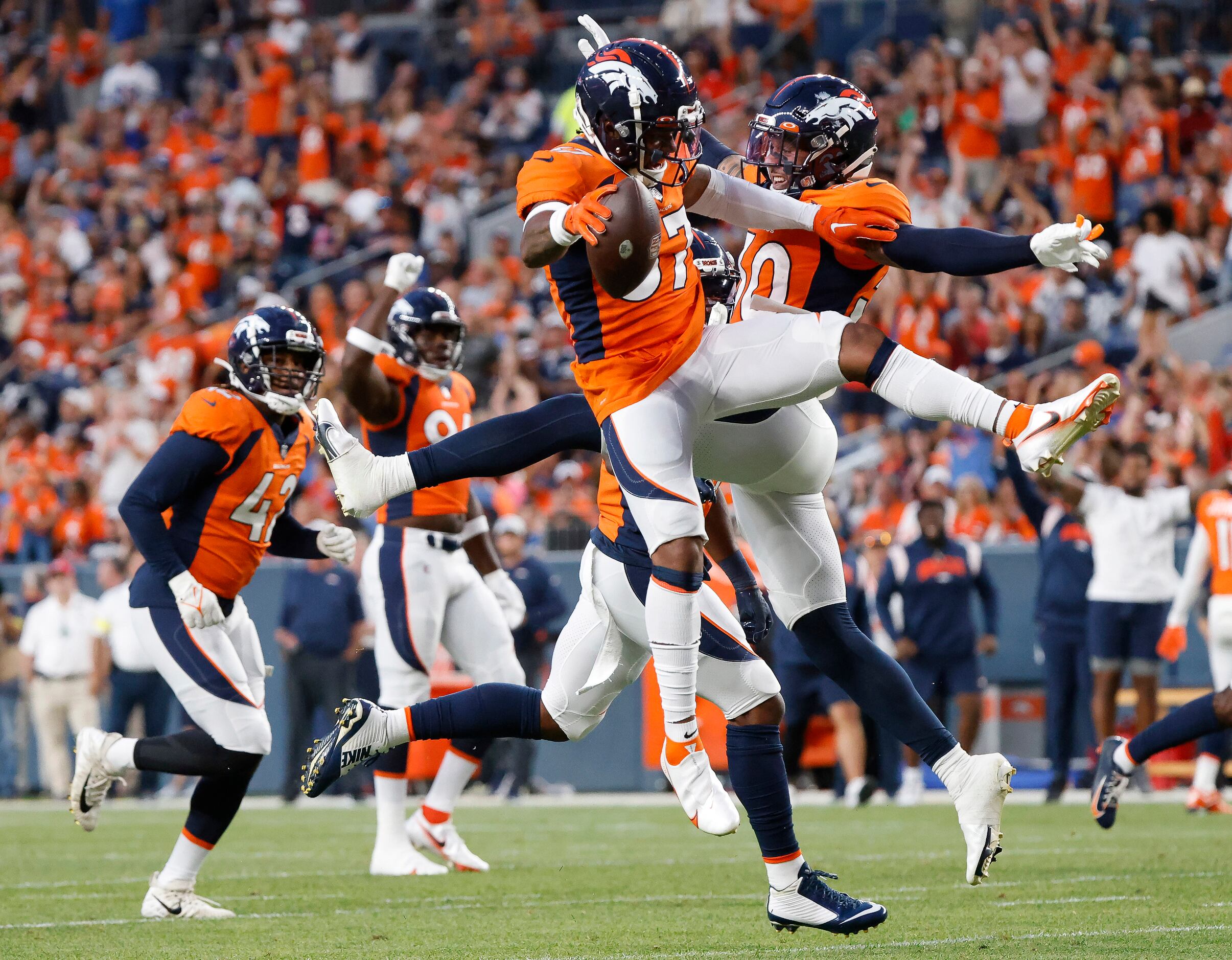 Denver Broncos safety P.J. Locke (37) runs a play against the