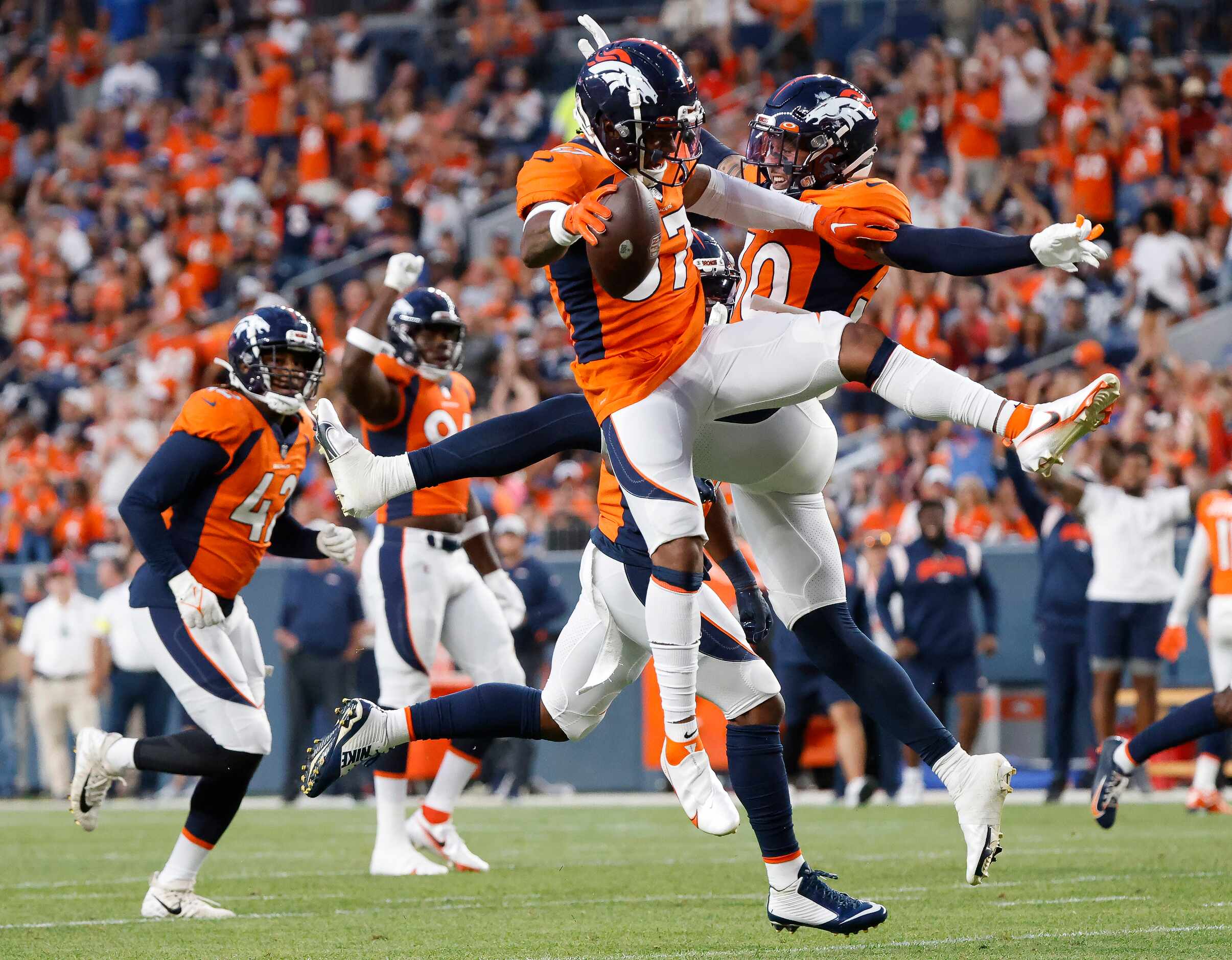 Denver Broncos safety P.J. Locke (37) celebrates his interception of Dallas Cowboys...