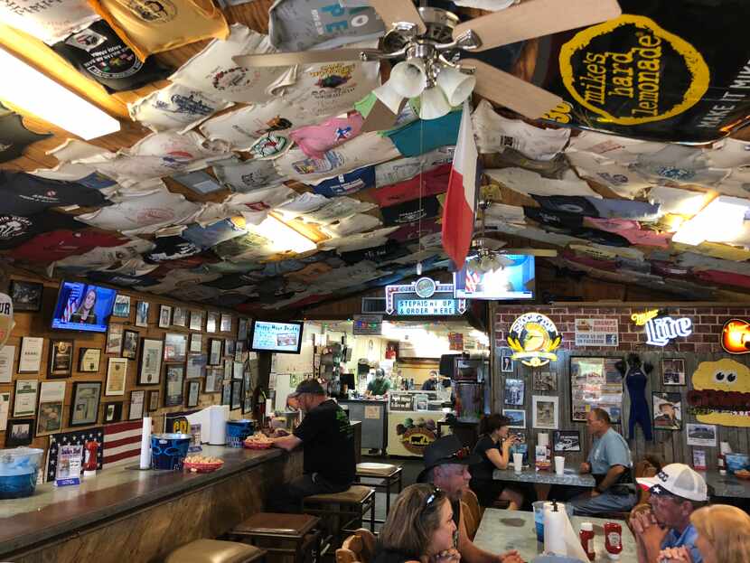 Grumps Burgers in Granbury shows off dozens of framed articles and awards that prove how...