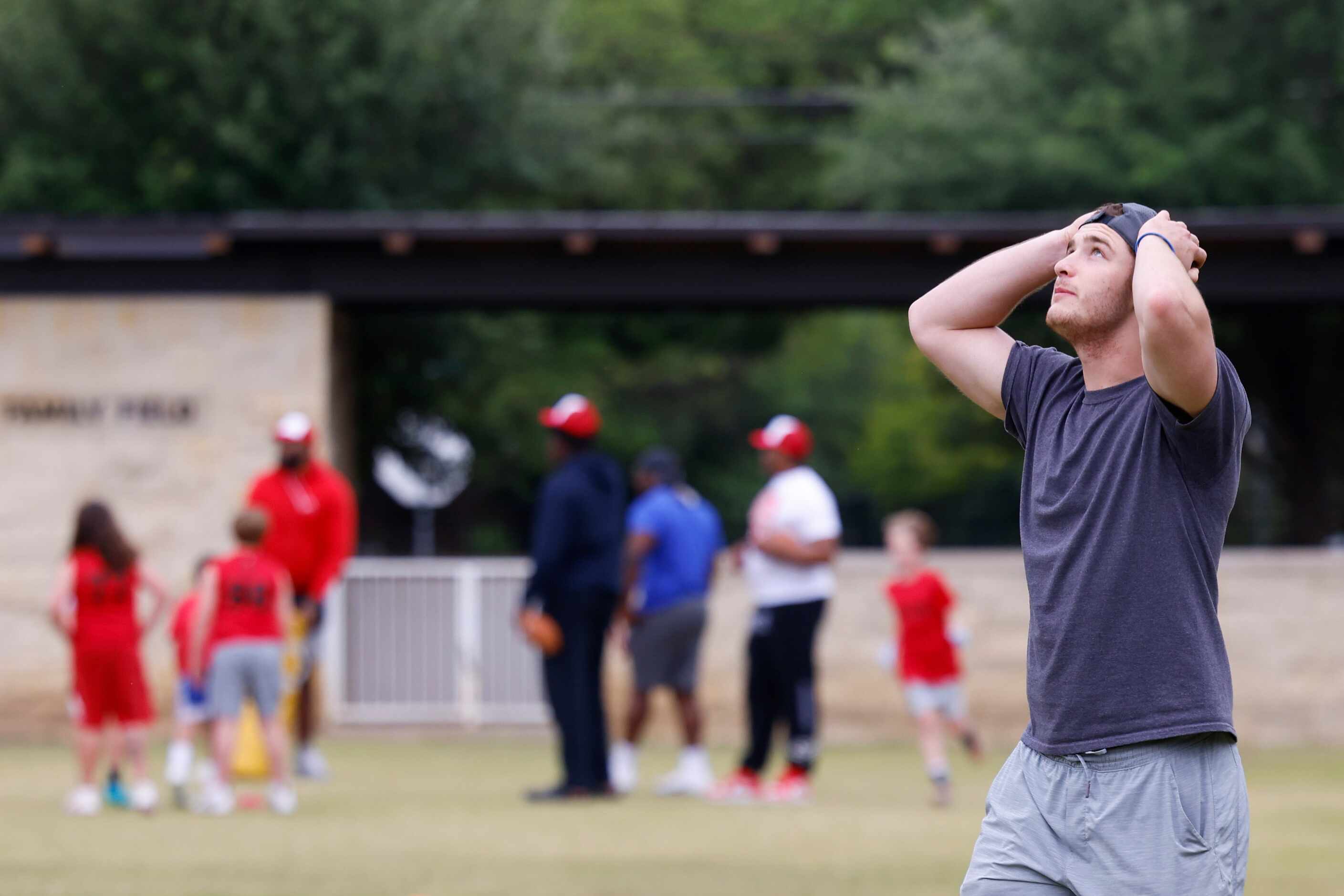 SMU QB Preston Stone reacts to a throw during a special session of football drills and...
