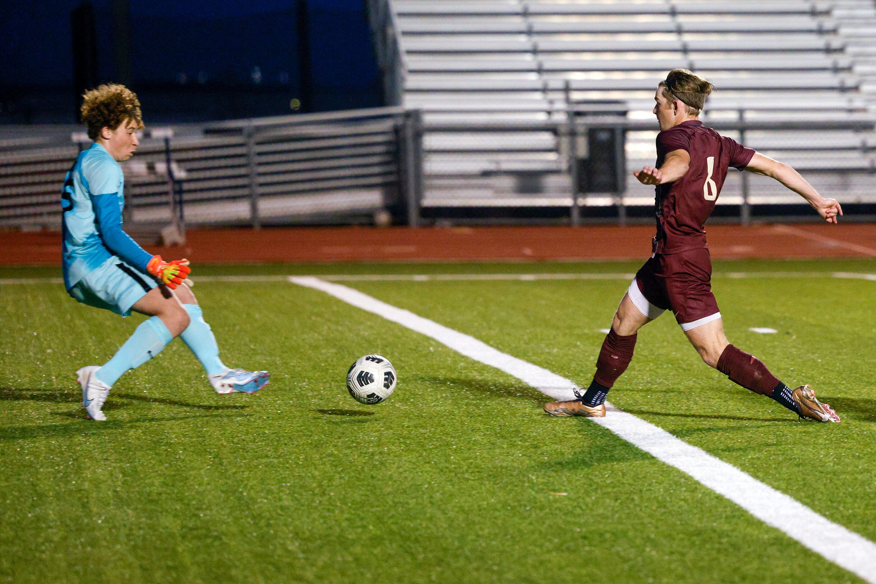 Frisco Heritage forward Jacob Culpepper (8) scores a goal past Frisco goalkeeper Benjamin...