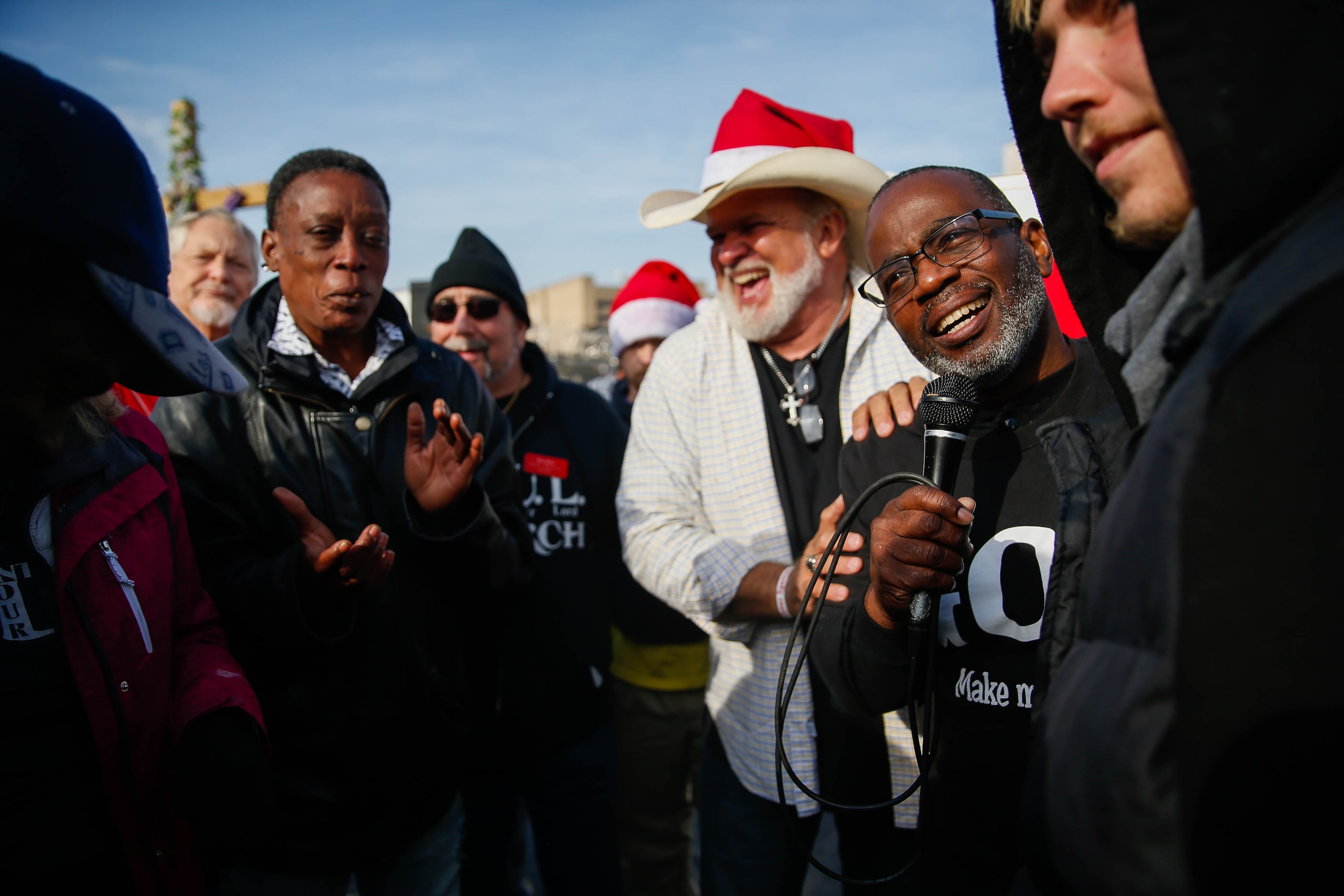 Pastor Leon Birdd (third from right) and Pastor Jeffery Parker (second from right) welcomed...