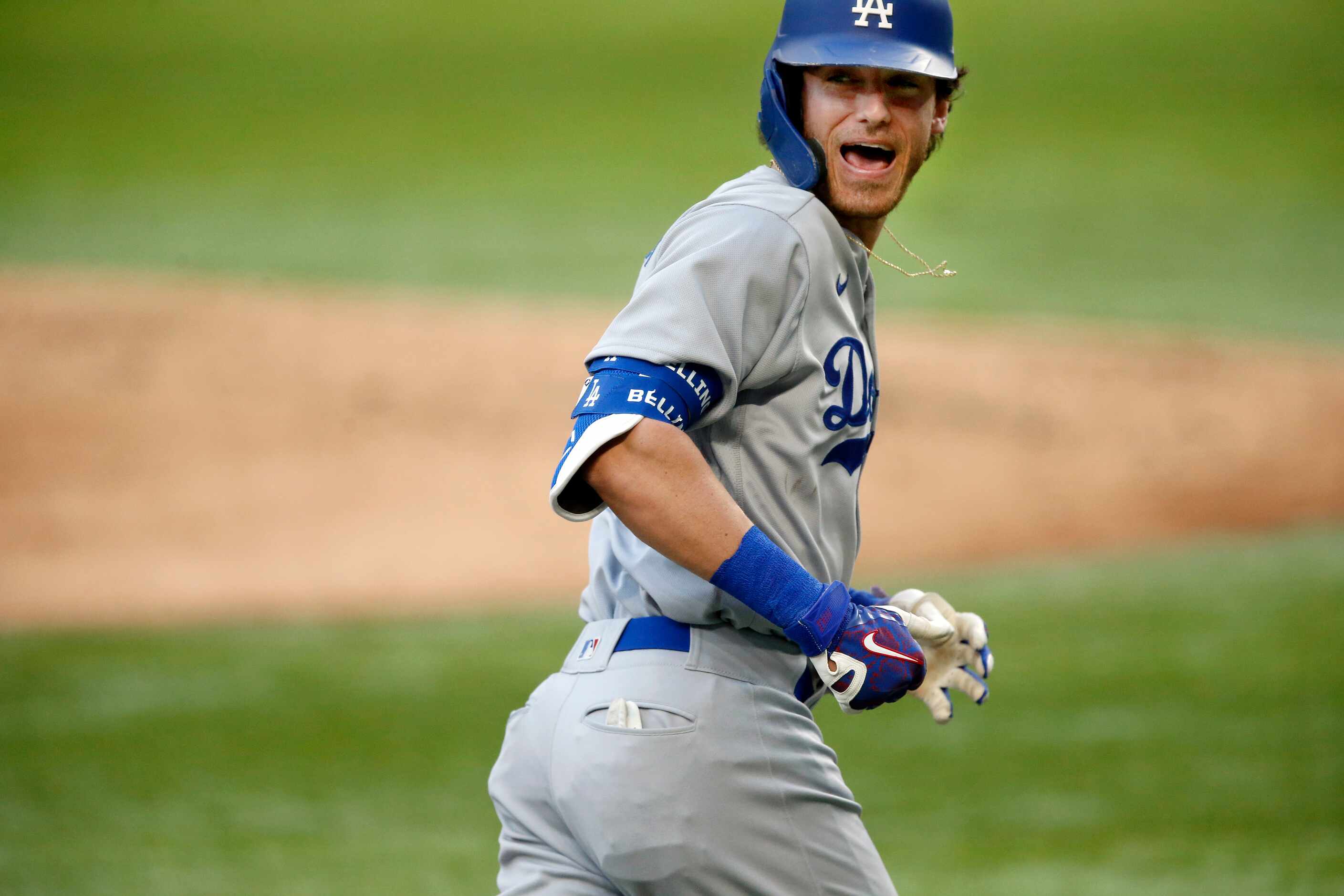 Los Angeles Dodgers center fielder Cody Bellinger (35) looks back over his shoulder as he...