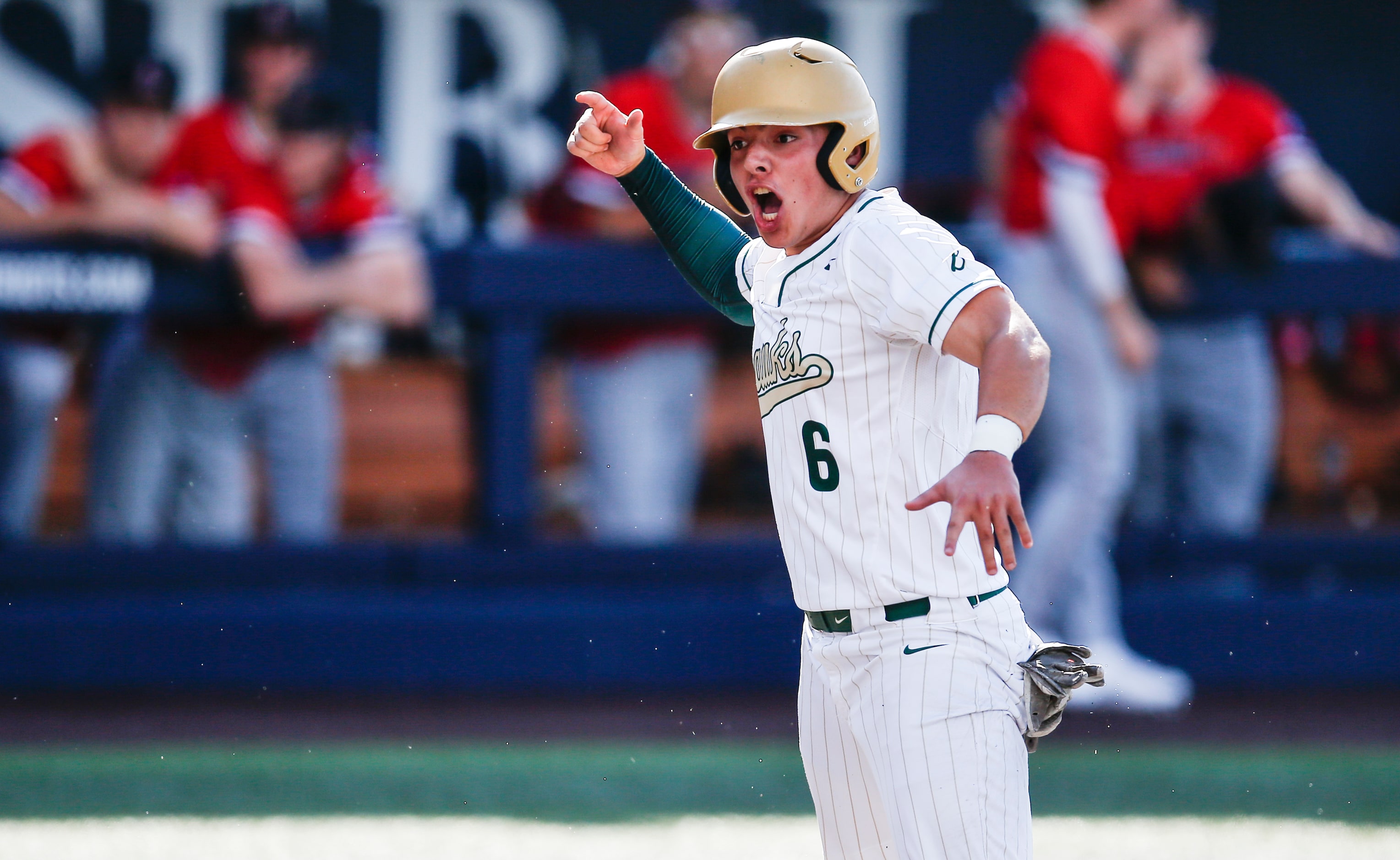 Birdville’s Bynum Martinez (6) celebrates scoring a run during the second inning of a high...