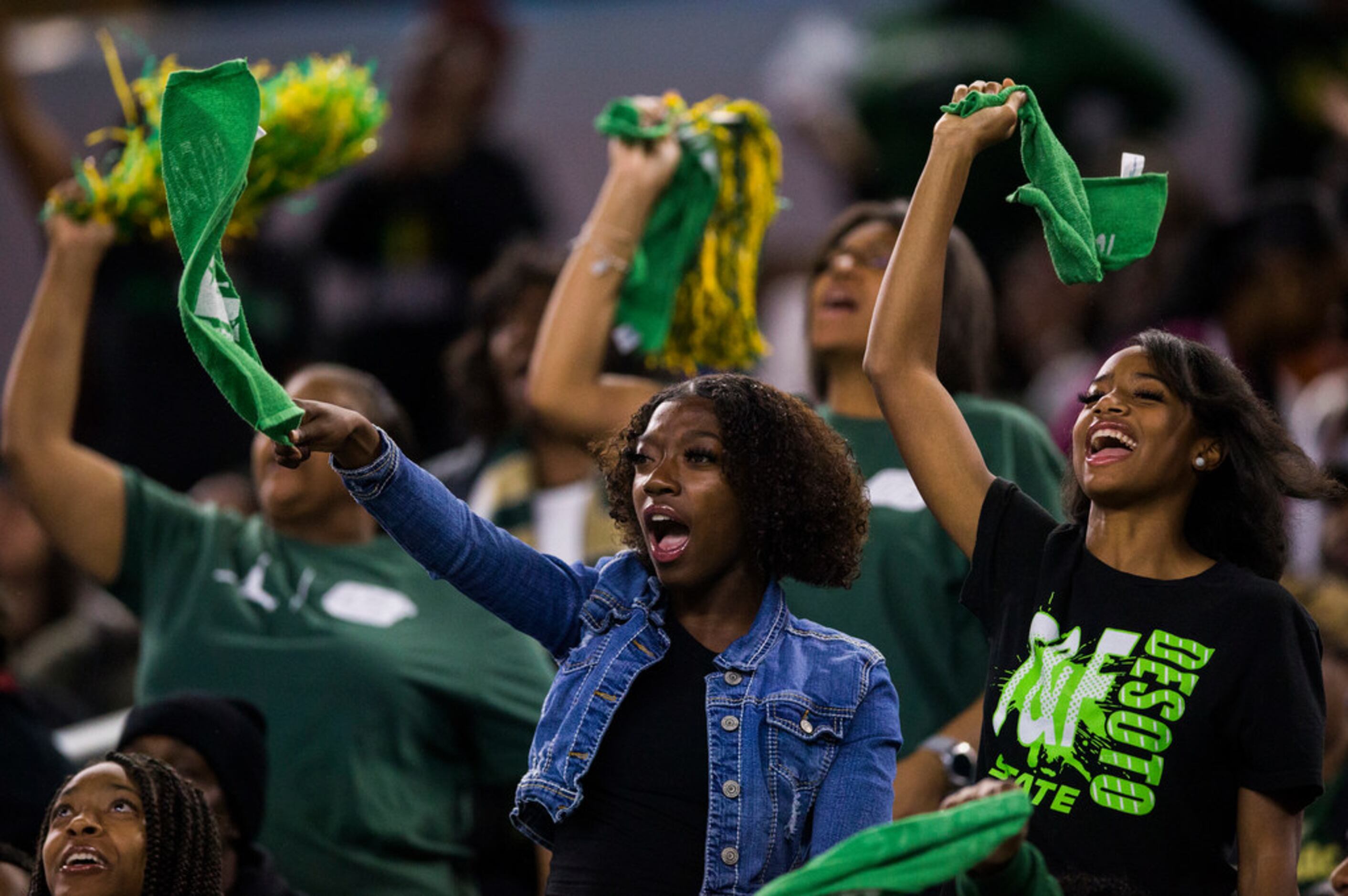 DeSoto fans cheer during the second quarter of a Class 6A Division I area-round high school...