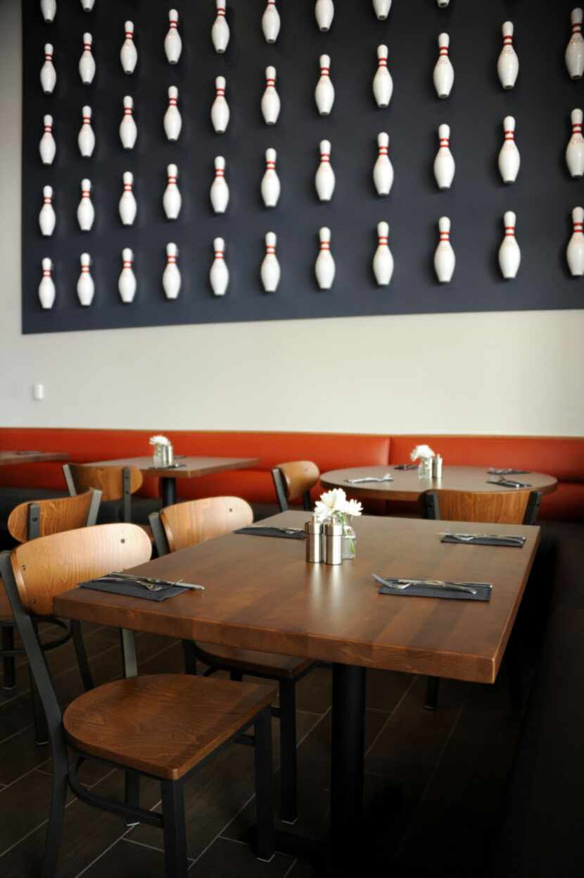 Guests can sit in the restaurant and enjoy a meal at Pinstack in Plano.