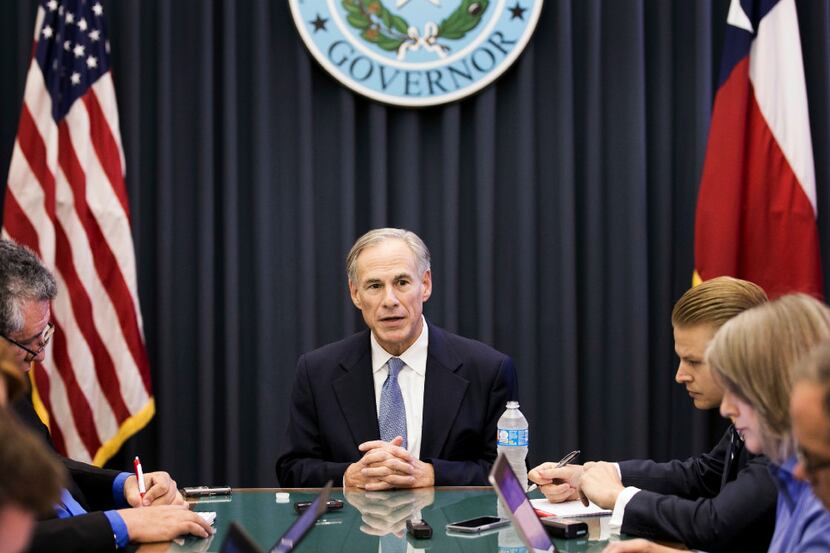 Texas Gov. Greg Abbott talks about the upcoming legislative session with reporters at the...