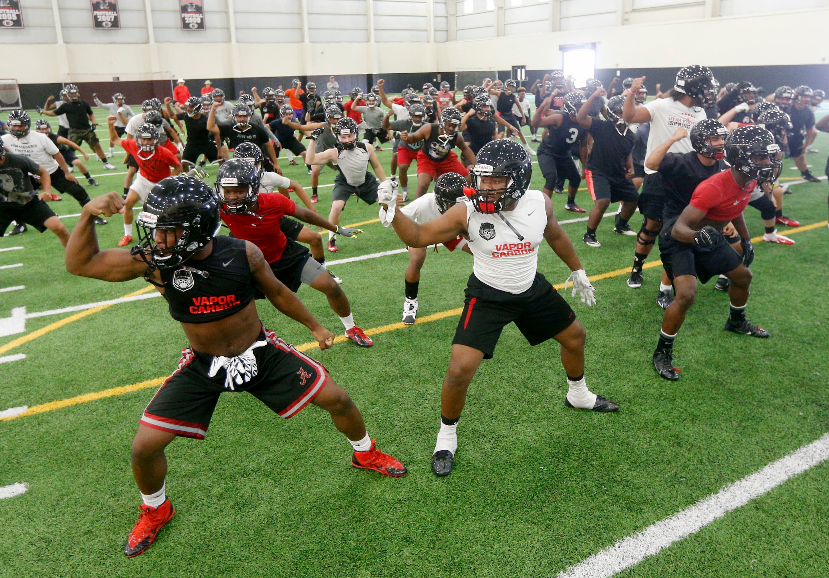 Players dance the Haka dance prior to Euless Trinity's first day of football practice at the...