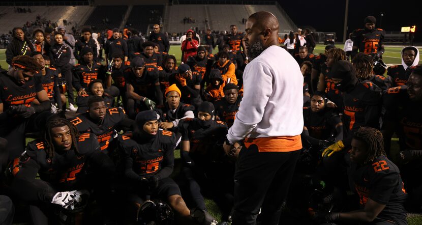 Lancaster head coach Leon Paul pauses to collect himself before speaking to his players...