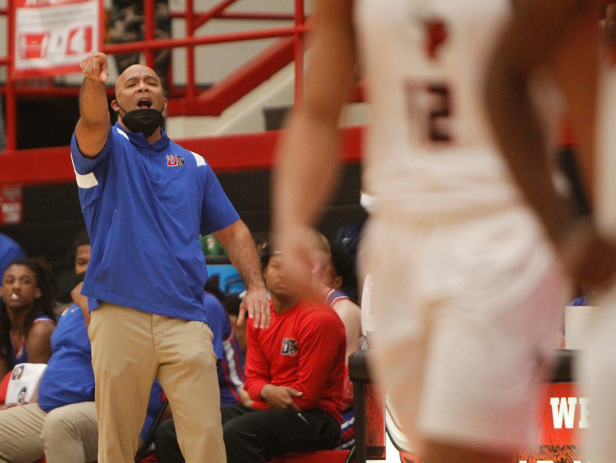 Duncanville head coach David Peavey directs his players during first half action against...