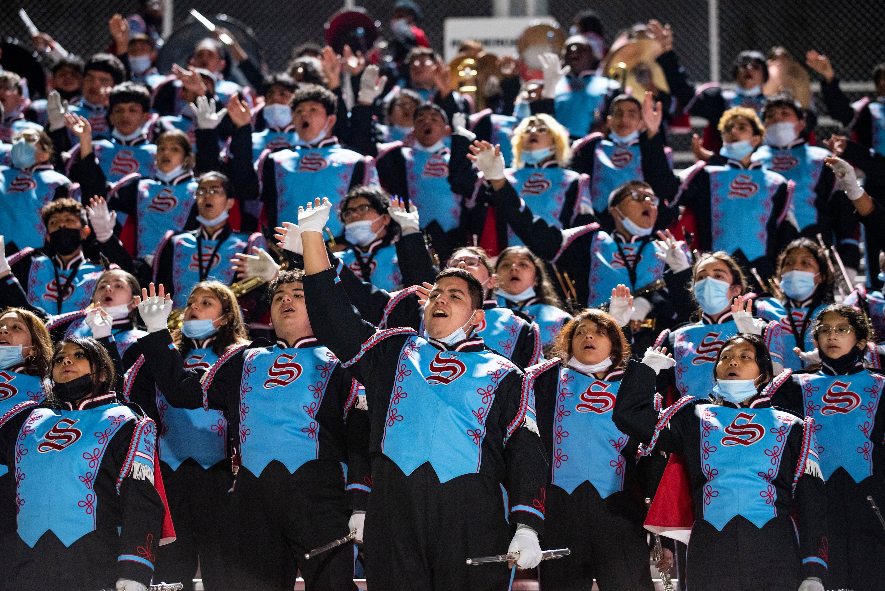 The Skyline band leads the crowd in a cheer during a District 10-6A game between...